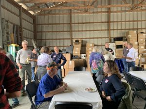 Clockwise from bottom left: Mark Holdren, seated, Tom Heitzman (in gray), Kathryn Adeney (eyes closed), Chris Holly in sunglasses, Roger Triplett, Eddie McKeithen (white shirt), Leslie LAndert, seated.