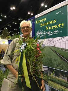 Roger Triplett with award for ipomoea microdactyla at FNGLA TLS